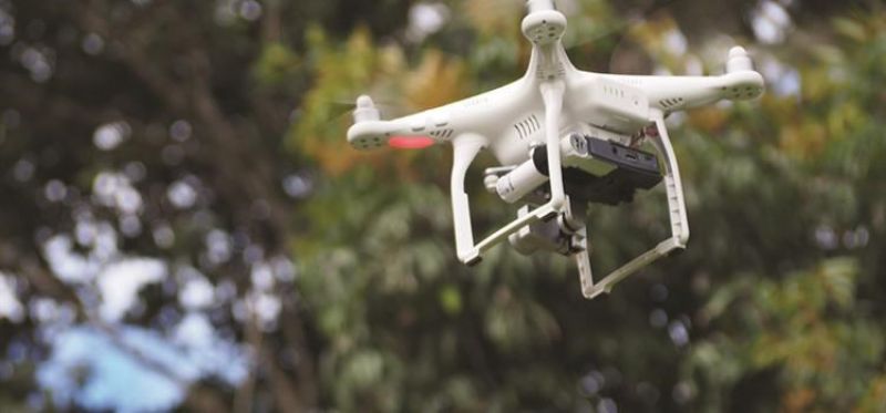 a medium shot of a drone in mid flight